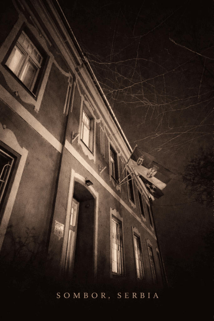 Black and white noir style illustration of flags on the Cultural Center Laza Kostic in Sombor Serbia with Sombor Serbia text