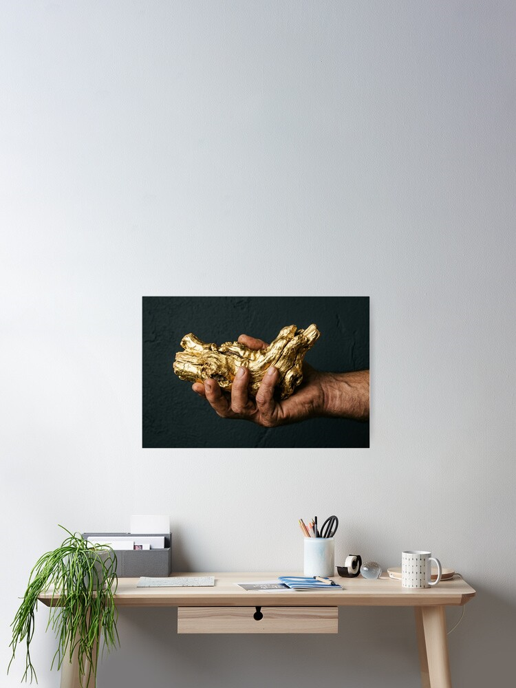 hand holding gold tree root concept design poster