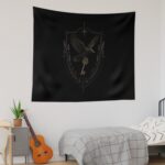Black and gold tapestry wall hanging featuring a secret society shield with a raven holding a key, an open book, and lavender accents in a dark academia aesthetic bedroom.